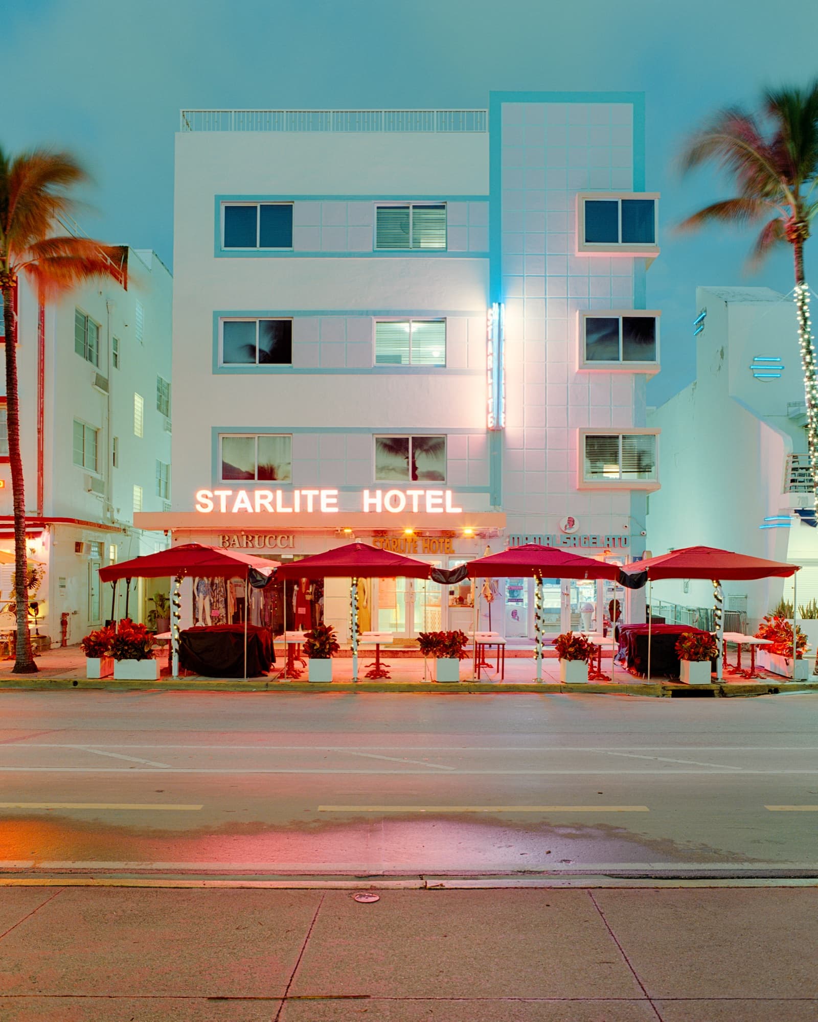 Film frame on Kodak Portra 400 — the Starlite Hotel neon glowing at dusk on Ocean Drive, Miami Beach